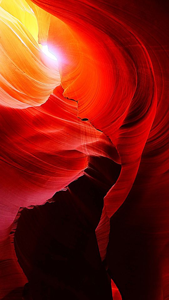 Light glowing through the curved red walls of Antelope Canyon