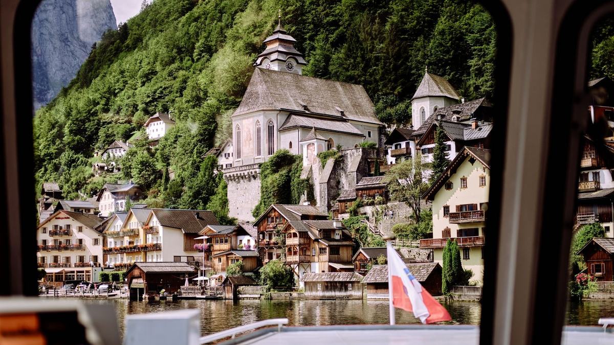 Hallstatt church and houses seen through the window of the ferry