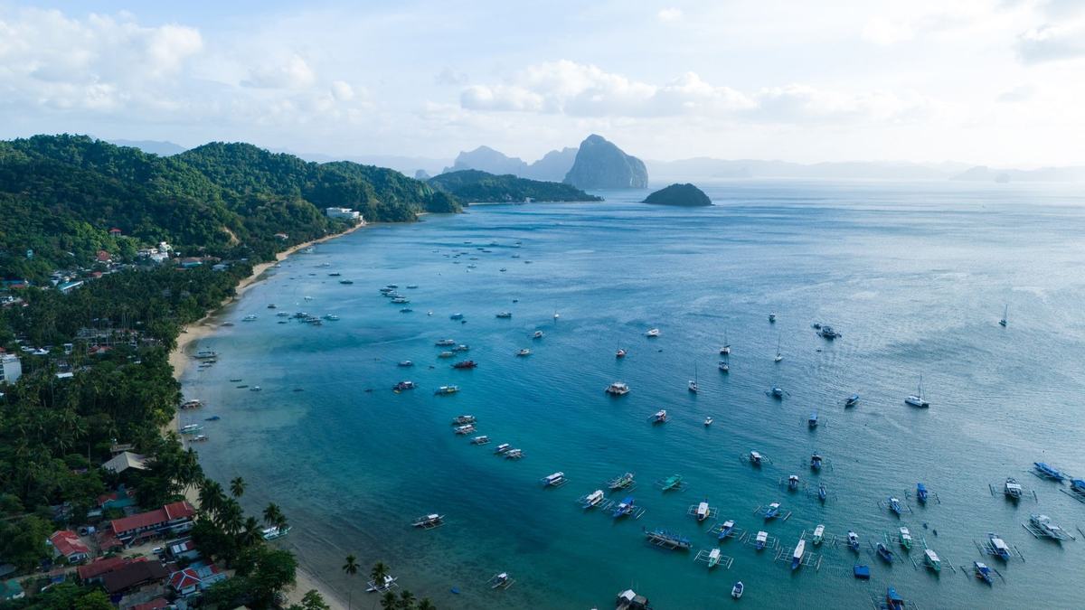 Aerial view of El Nido town and its bay full of boats