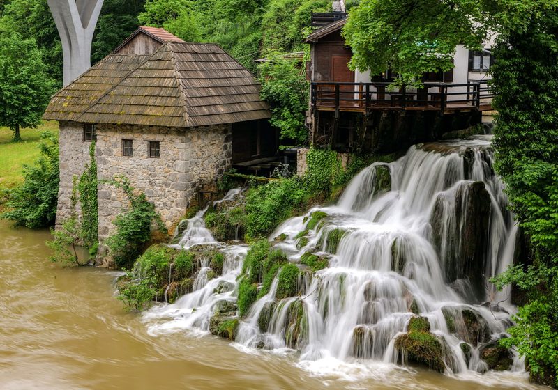 Wooden houses and waterfalls in the village of Rastoke