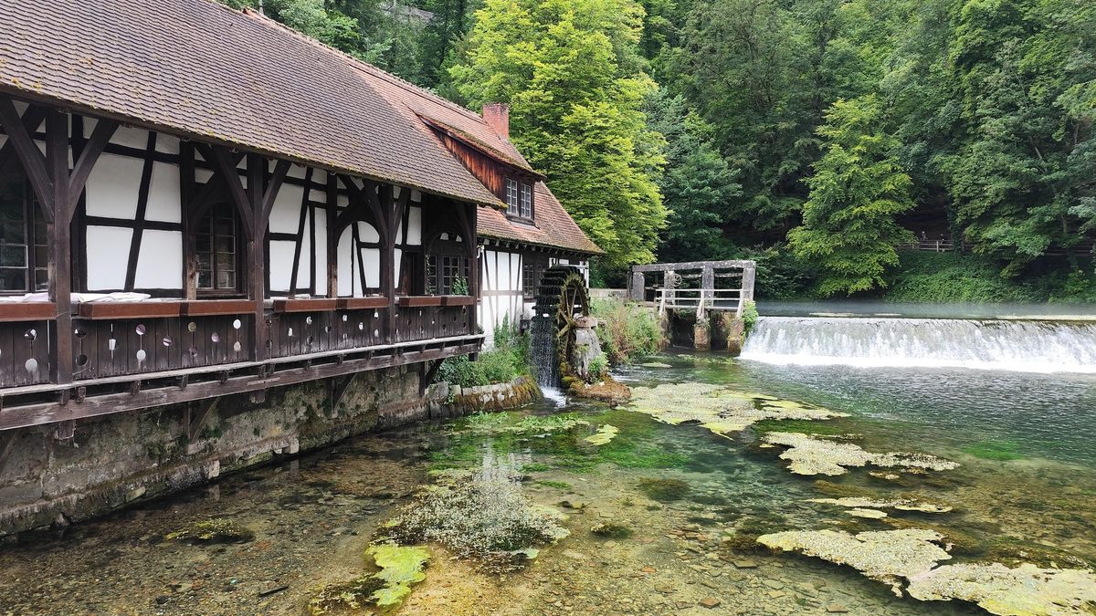 Wooden houses beside a waterfall in Rastoke