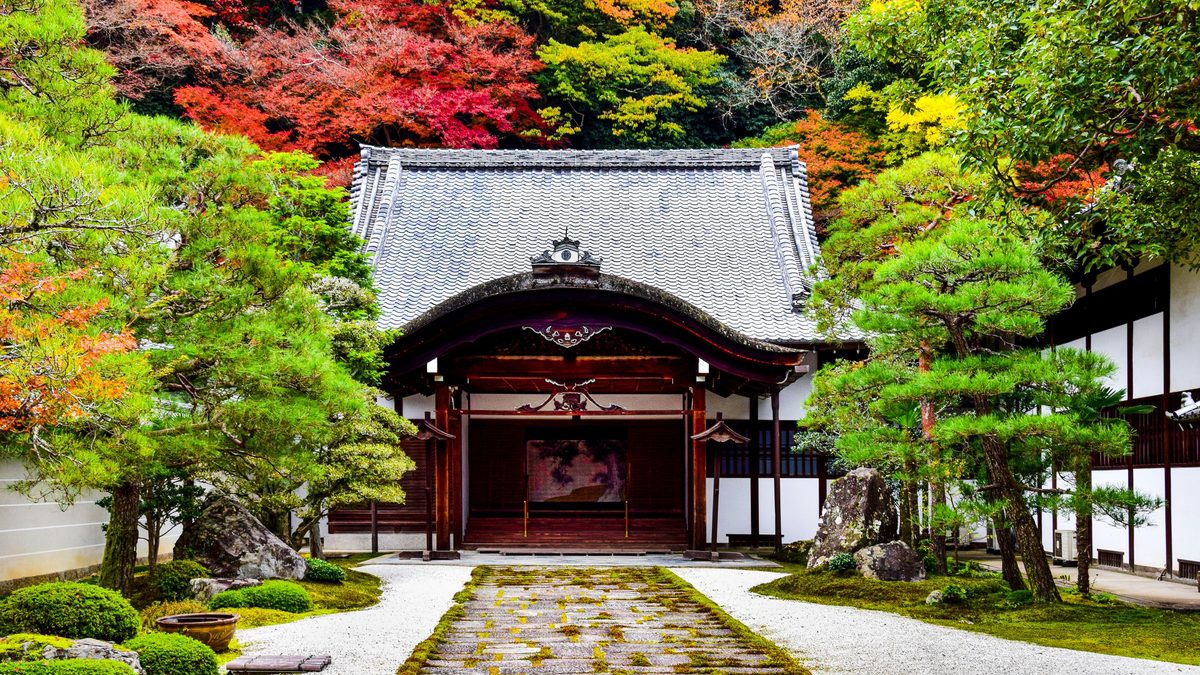 Yamadera temple surrounded by red and orange autumn leaves